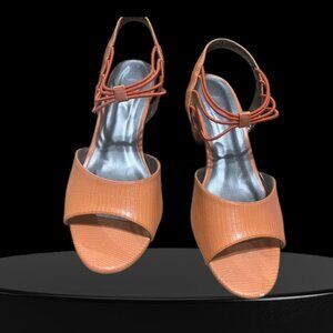 An Orange Strappy Block-Heel Sandals With A Lizard-Embossed Texture.